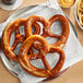 A plate of Ditsch soft pretzels on a table.