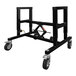 A black metal adjustable support table with wheels.