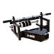 A black and silver Encore Packaging steel wall-mount paper dispenser with a roller.