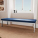 A blue Lesro Newport bench with a blue cushion on it.