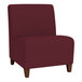 A burgundy Lesro Ravenna guest chair with wooden legs.