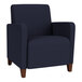 A Lesro Ravenna navy fabric guest arm chair with walnut wood legs.