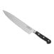 A Choice Classic chef knife with a black handle.