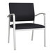 A Lesro Newport black vinyl oversized guest chair with silver legs.