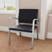 A black Lesro Newport Patriot Plus chair with silver metal arms.