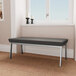 A black Lesro Newport bench with silver legs in a lounge area.