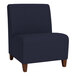 A navy blue Lesro Ravenna guest chair with wooden legs.