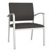 A black Lesro Newport oversized guest chair with silver legs.