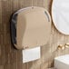 A Lavex Pro Sand paper towel dispenser on a wall.