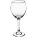 An Acopa Bouquet wine glass with a stem filled with wine on a white background.