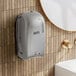 A white Lavex Pro automatic foam soap dispenser on a wall.