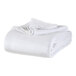 A folded Berkshire Hospitality twin size white blanket