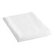 A white folded Berkshire Hospitality king size top sheet with a rattan pucker jacquard pattern.