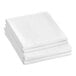 A close-up of a stack of Berkshire Hospitality SuiteDream white sheets.