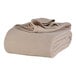 A folded natural beige Berkshire Hospitality AllSoft King Size cotton blanket.