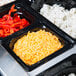 A Vollrath Super Pan food pan with a tray of food including french fries and cheese.