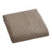 A white Berkshire Hospitality coverlet with a diamond pattern in a beige color.