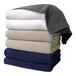 A stack of folded Berkshire Hospitality gray fleece blankets.