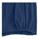 A blue fabric box spring cover with a diamond pattern.