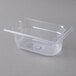 A Vollrath clear polycarbonate food pan with a lid.