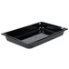 A Vollrath black plastic food pan on a counter.