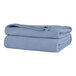 A stack of Berkshire Hospitality periwinkle microfleece blankets.
