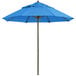 A blue Grosfillex Windmaster umbrella with a white pole.