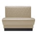 A beige leather tufted booth with a black base.