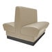 A beige booth with black legs and a black seat.