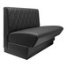 A black leather booth seat with a diamond tufted single back.
