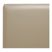A close up of a tan leather booth back.