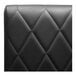 A black leather QA Group booth back with diamond tufting.