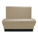A beige leather booth with black legs.
