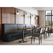 A QA Group long graphite single back booth at a table in a restaurant dining area.