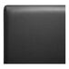 A close-up of a black leather surface on a QA Group black double back booth.