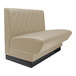 A beige leather booth with a black base.