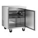 A stainless steel Avantco undercounter freezer with a door open.