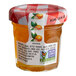 A Bonne Maman mini jar of orange marmalade on a counter with a label.