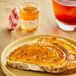 A plate of toast with Bonne Maman Orange Marmalade on it.