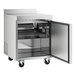 An Avantco stainless steel worktop freezer with a door open.