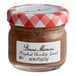 A Bonne Maman Hazelnut Chocolate Spread mini jar on a table.