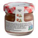 A Bonne Maman mini jar of hazelnut chocolate spread with a brown label.