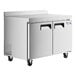 An Avantco stainless steel worktop freezer with two doors on wheels.