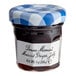 A Bonne Maman mini jar of Muscat grape jelly with a white label and a blue and white checkered lid.