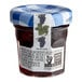A Bonne Maman mini jar of Muscat Grape jelly with a blue and white checkered lid.