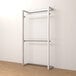 A white metal wall-mounted retail display with 2 hangrails.