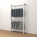 An Econoco wall-mount retail display rack with clothes hanging on it.