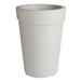 A gray round planter with a round top.
