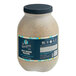 A jar of Sir Kensington's Spicy Brown Mustard with a blue label and a black lid.