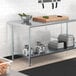 A Steelton galvanized steel undershelf on a work table.